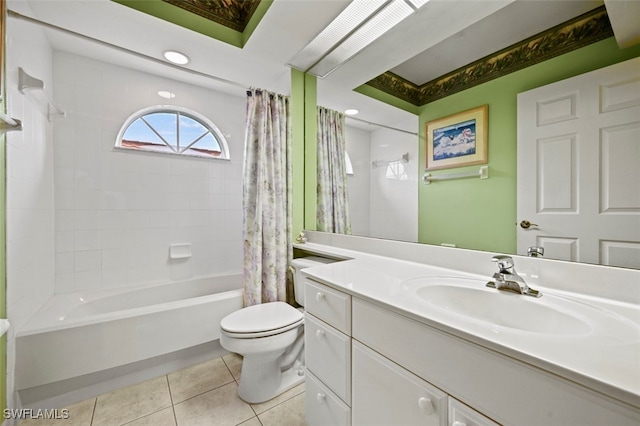 full bathroom featuring vanity, toilet, tile patterned flooring, and shower / bath combo with shower curtain