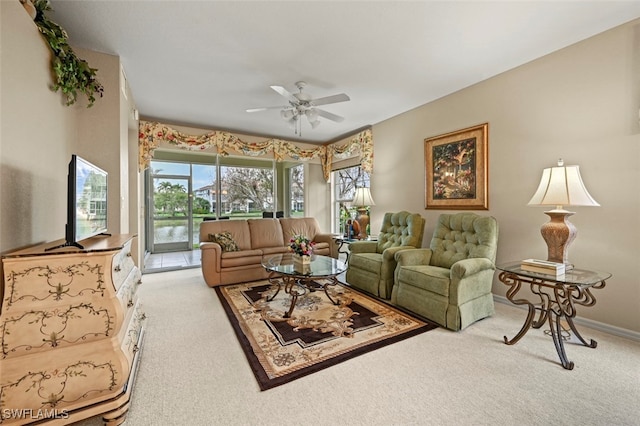 living room featuring light colored carpet and ceiling fan