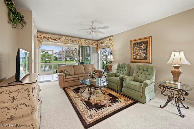 living room featuring carpet flooring and ceiling fan