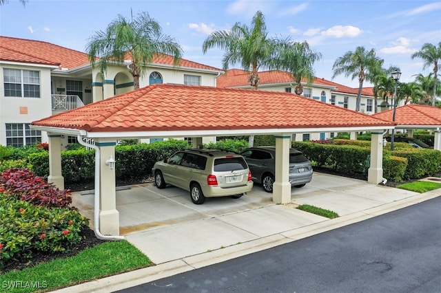 view of vehicle parking with a carport