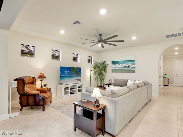 living room featuring ceiling fan and light tile patterned floors