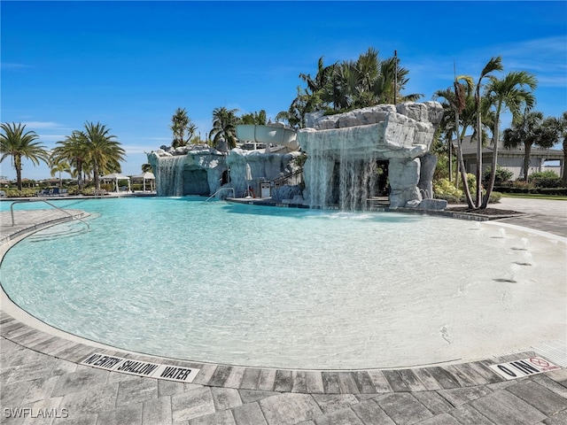 view of pool featuring pool water feature