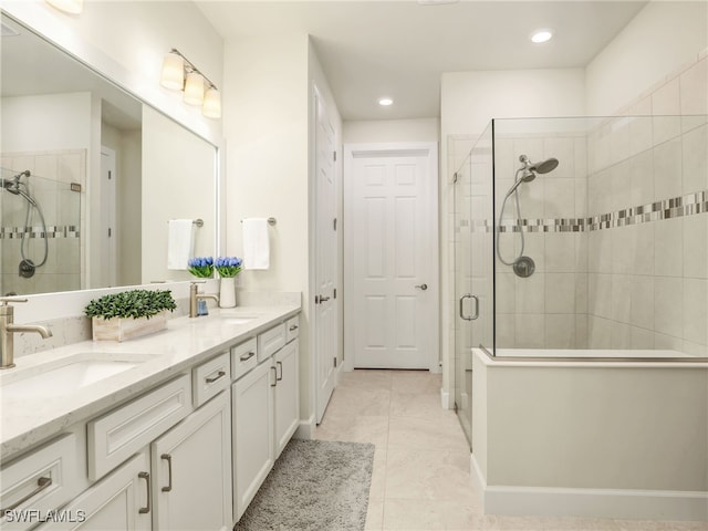 bathroom with vanity and an enclosed shower