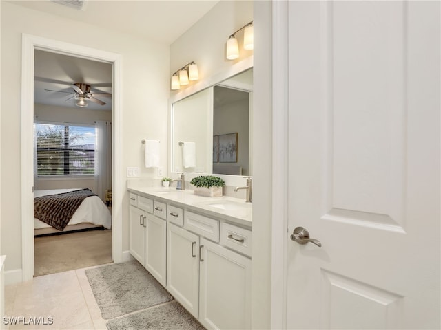 bathroom with ceiling fan, vanity, and tile patterned flooring