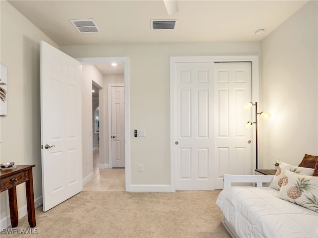 carpeted bedroom with a closet