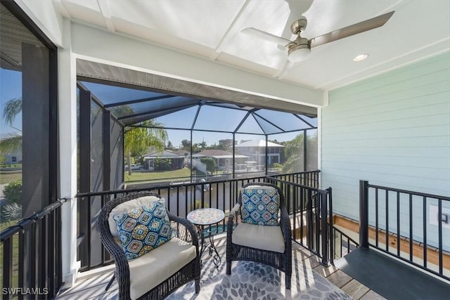 sunroom featuring ceiling fan