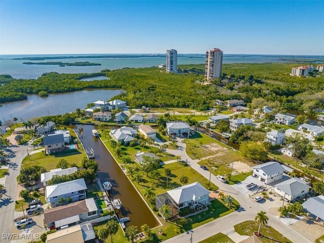 bird's eye view with a water view and a residential view