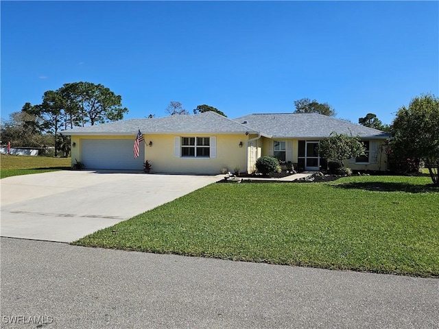 single story home featuring a garage and a front yard