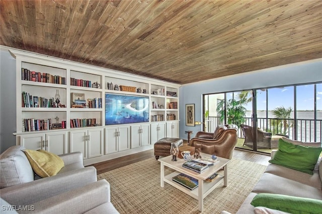 living room with wood finished floors, wood ceiling, and built in shelves