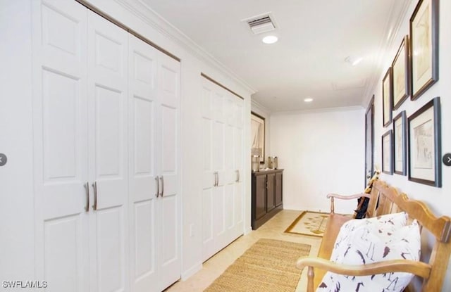 hallway featuring crown molding