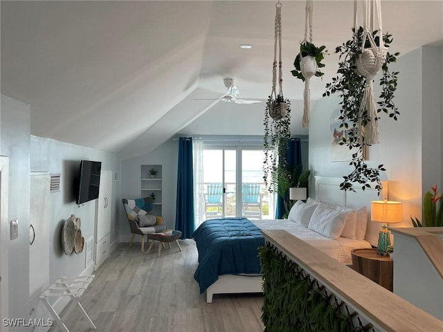 bedroom with lofted ceiling and hardwood / wood-style floors