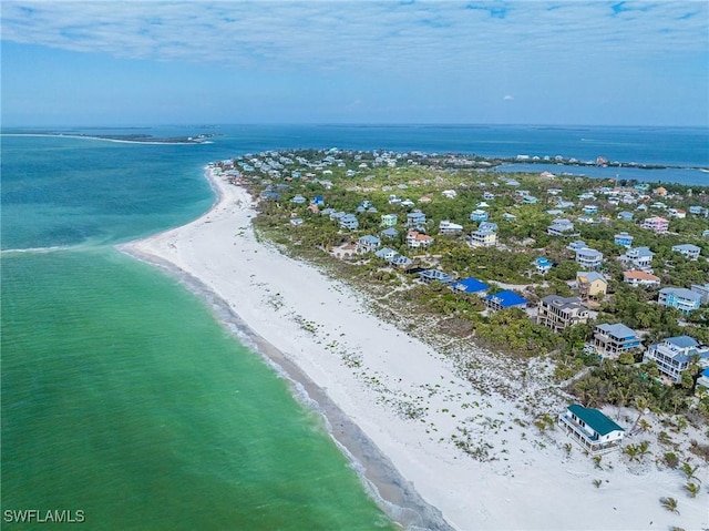 bird's eye view featuring a view of the beach and a water view