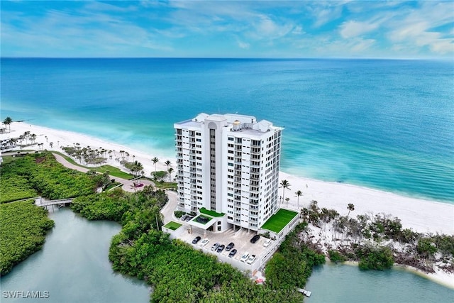 drone / aerial view with a view of the beach and a water view