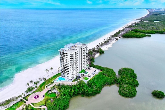 birds eye view of property featuring a water view and a view of the beach