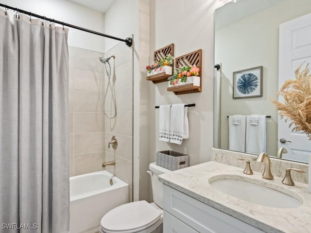 full bathroom featuring toilet, vanity, and shower / bathtub combination with curtain