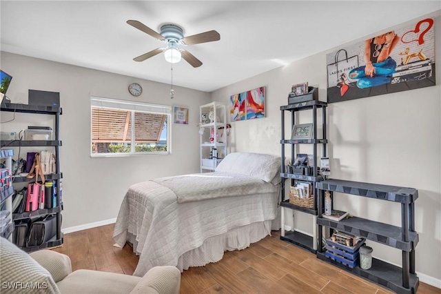 bedroom with ceiling fan and hardwood / wood-style floors