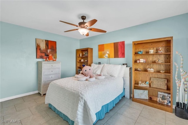 tiled bedroom with ceiling fan