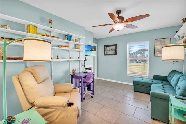 sitting room with ceiling fan and light tile patterned floors