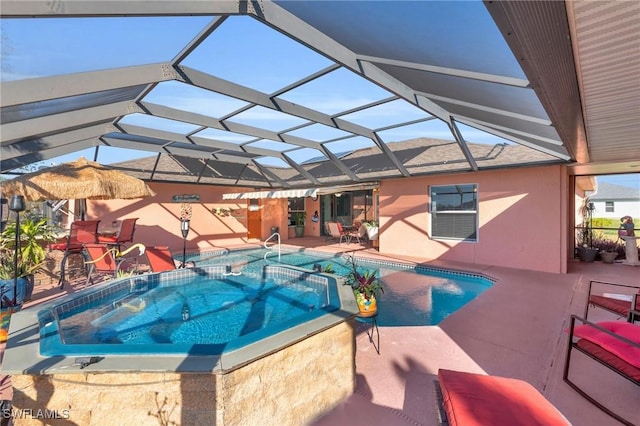 view of swimming pool featuring a patio, an in ground hot tub, and glass enclosure