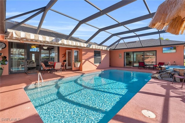 view of pool featuring a patio, a lanai, and a jacuzzi