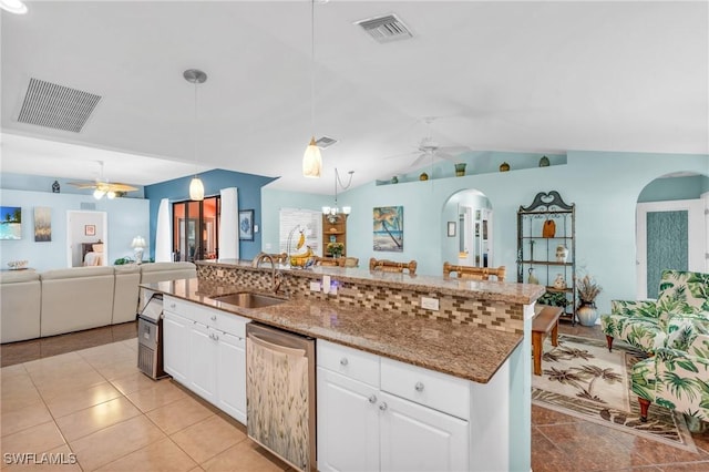 kitchen with white cabinets, sink, pendant lighting, and dishwashing machine