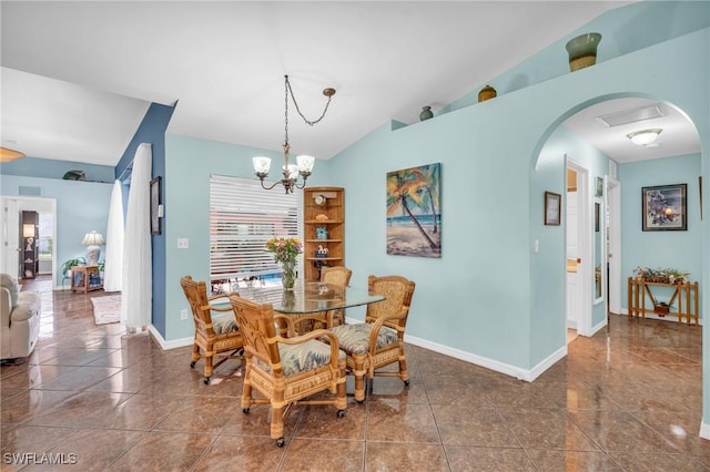 tiled dining area with lofted ceiling, a chandelier, and a healthy amount of sunlight