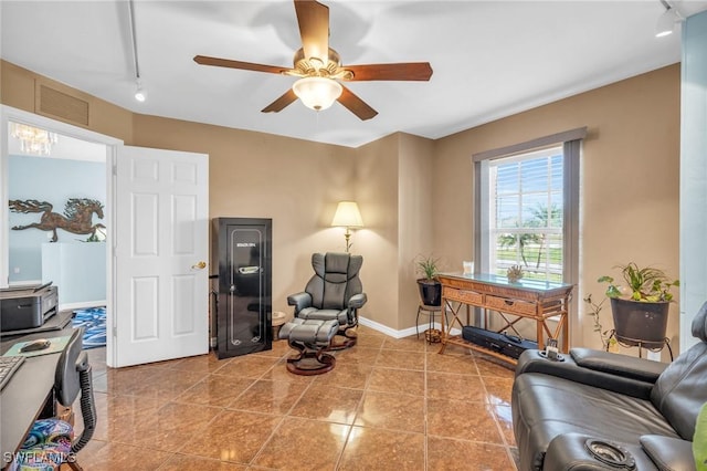 living room with ceiling fan, track lighting, and tile patterned flooring