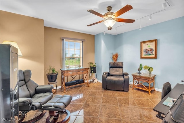 living room with track lighting, tile patterned floors, and ceiling fan