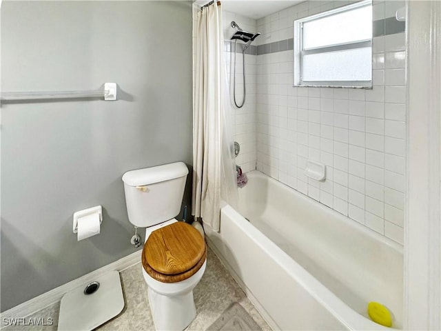 bathroom featuring toilet, tile patterned flooring, and shower / tub combo with curtain