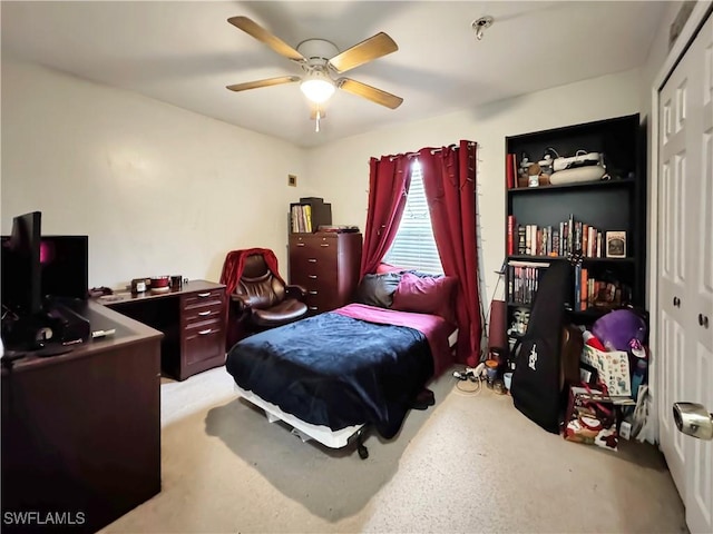 bedroom with ceiling fan and a closet