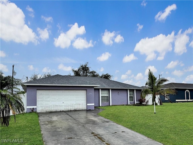 single story home featuring a garage and a front yard