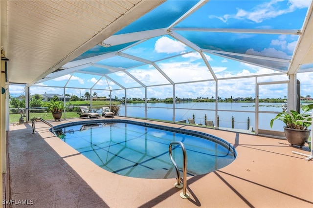 outdoor pool with a patio, a water view, and a lanai