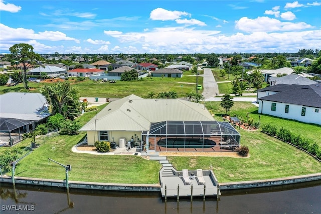 aerial view featuring a residential view and a water view