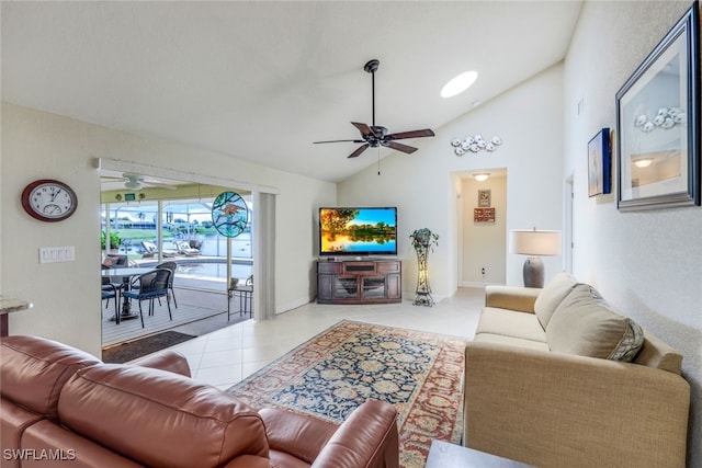 tiled living area featuring lofted ceiling and a ceiling fan