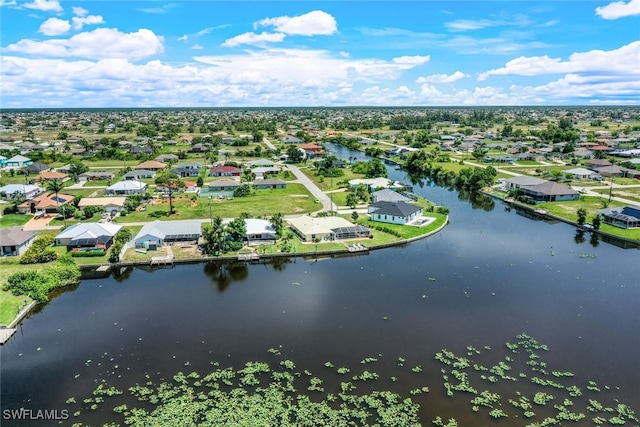 birds eye view of property featuring a residential view and a water view