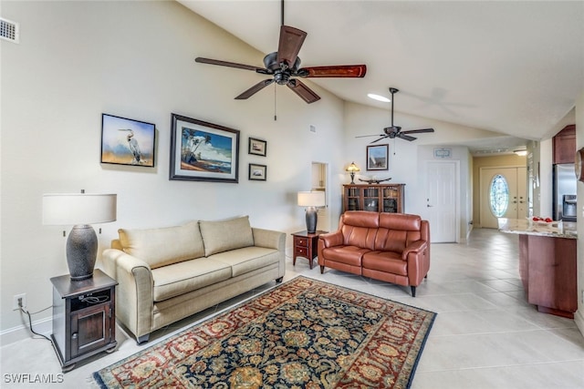 living room featuring visible vents, a ceiling fan, baseboards, light tile patterned flooring, and lofted ceiling