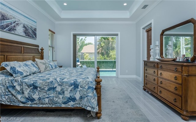 bedroom with crown molding, access to outside, and a raised ceiling