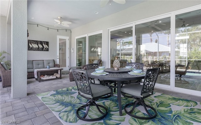 sunroom with ceiling fan