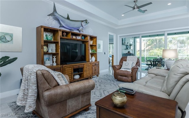 living room with ornamental molding and ceiling fan