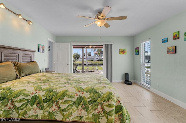 bedroom with ceiling fan and access to outside