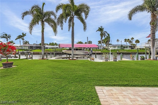 exterior space featuring a dock and a water view