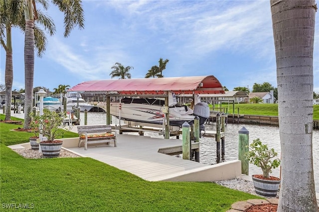 dock area with a water view and a yard