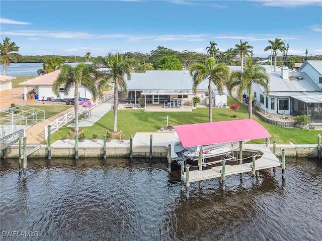 view of dock featuring a yard and a water view