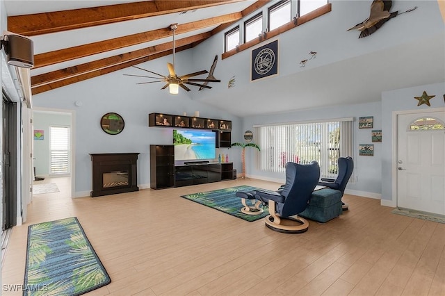 living room featuring ceiling fan, high vaulted ceiling, beam ceiling, and wood-type flooring