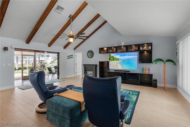 living room with high vaulted ceiling, light hardwood / wood-style floors, and beam ceiling