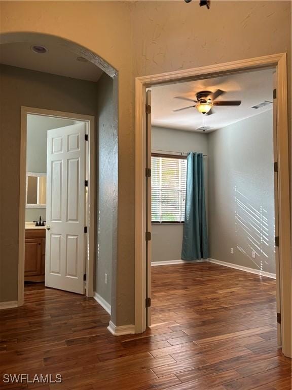 corridor with dark hardwood / wood-style floors