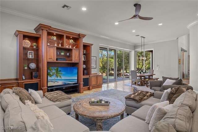 living room with light tile patterned floors, crown molding, and ceiling fan