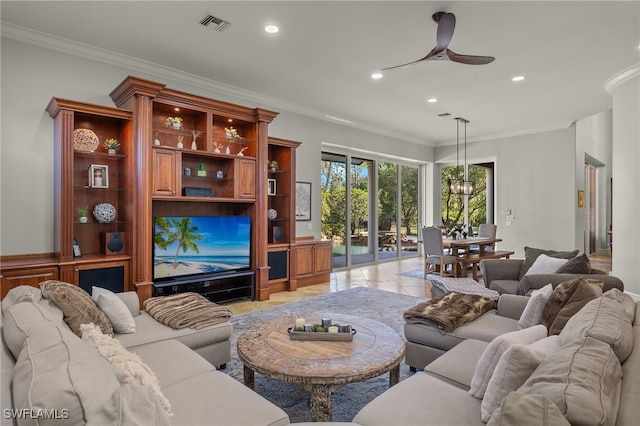 living room with recessed lighting, ceiling fan, crown molding, and a chandelier