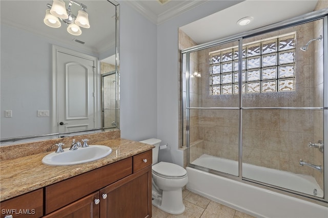 full bathroom featuring bath / shower combo with glass door, vanity, toilet, crown molding, and tile patterned floors