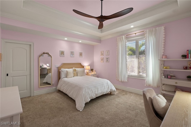 bedroom featuring crown molding, a raised ceiling, carpet floors, recessed lighting, and baseboards